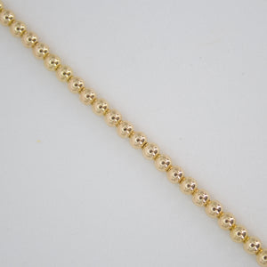 Pulsera de bolitas en oro amarillo 14k.