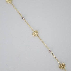 Pulsera corazones en oro combinado 14k.