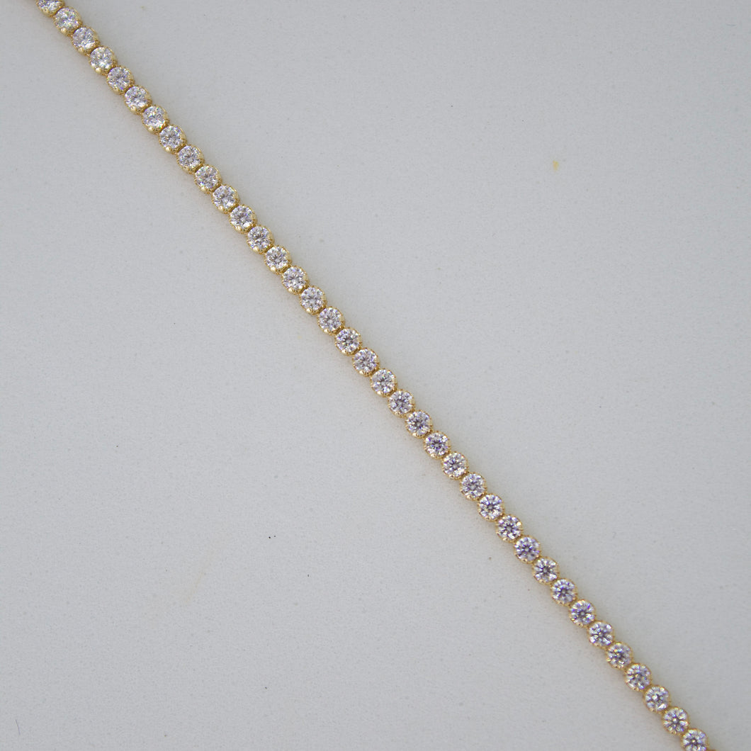 Pulsera con zirconias en oro amarillo 14k.