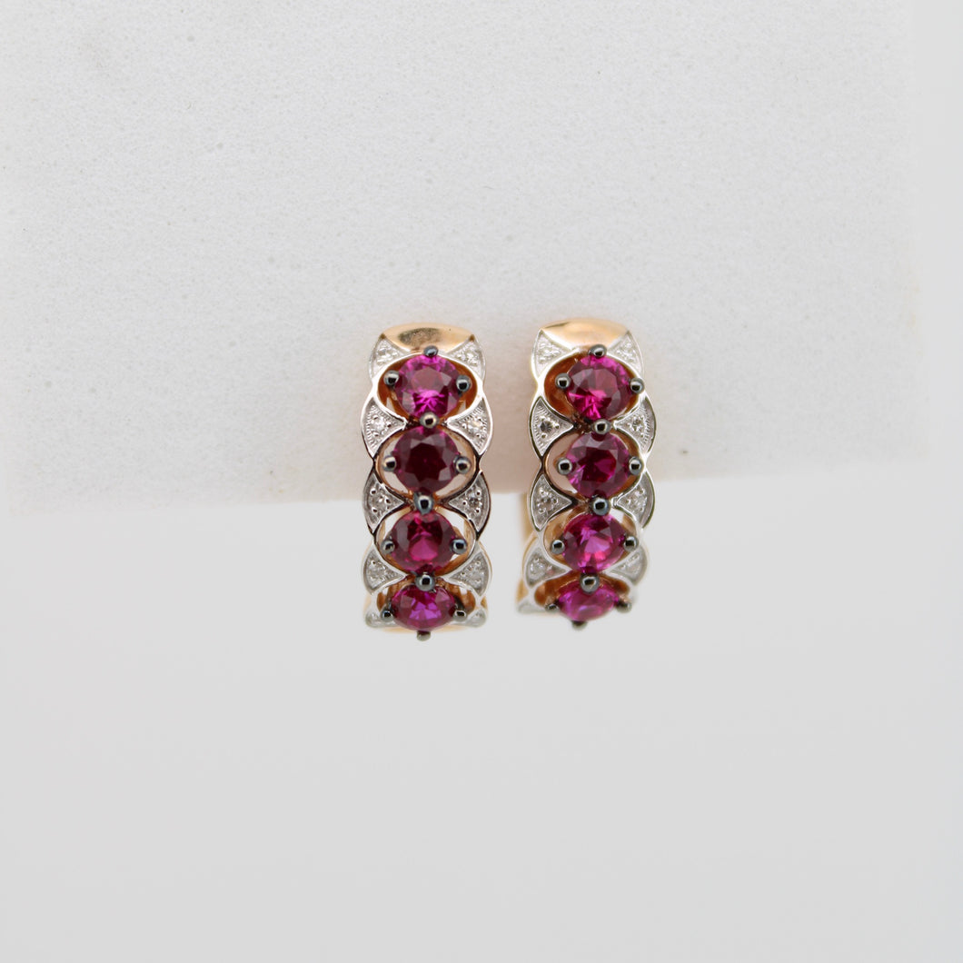 Aretes en oro amarillo 14k con rubíes y diamantes.