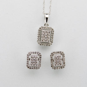 Juego en oro blanco 14k con diamantes.