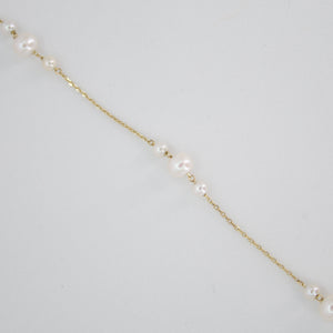 Pulsera con perlas en oro amarillo 14k.