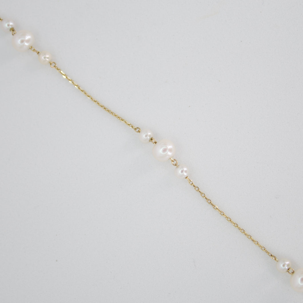 Pulsera con perlas en oro amarillo 14k.