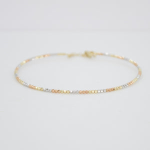 Pulsera rígida de bolitas en oro florentino 14k.