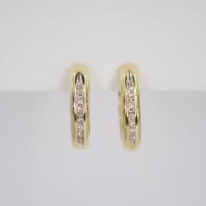 Arracadas en oro amarillo 14k con diamantes.