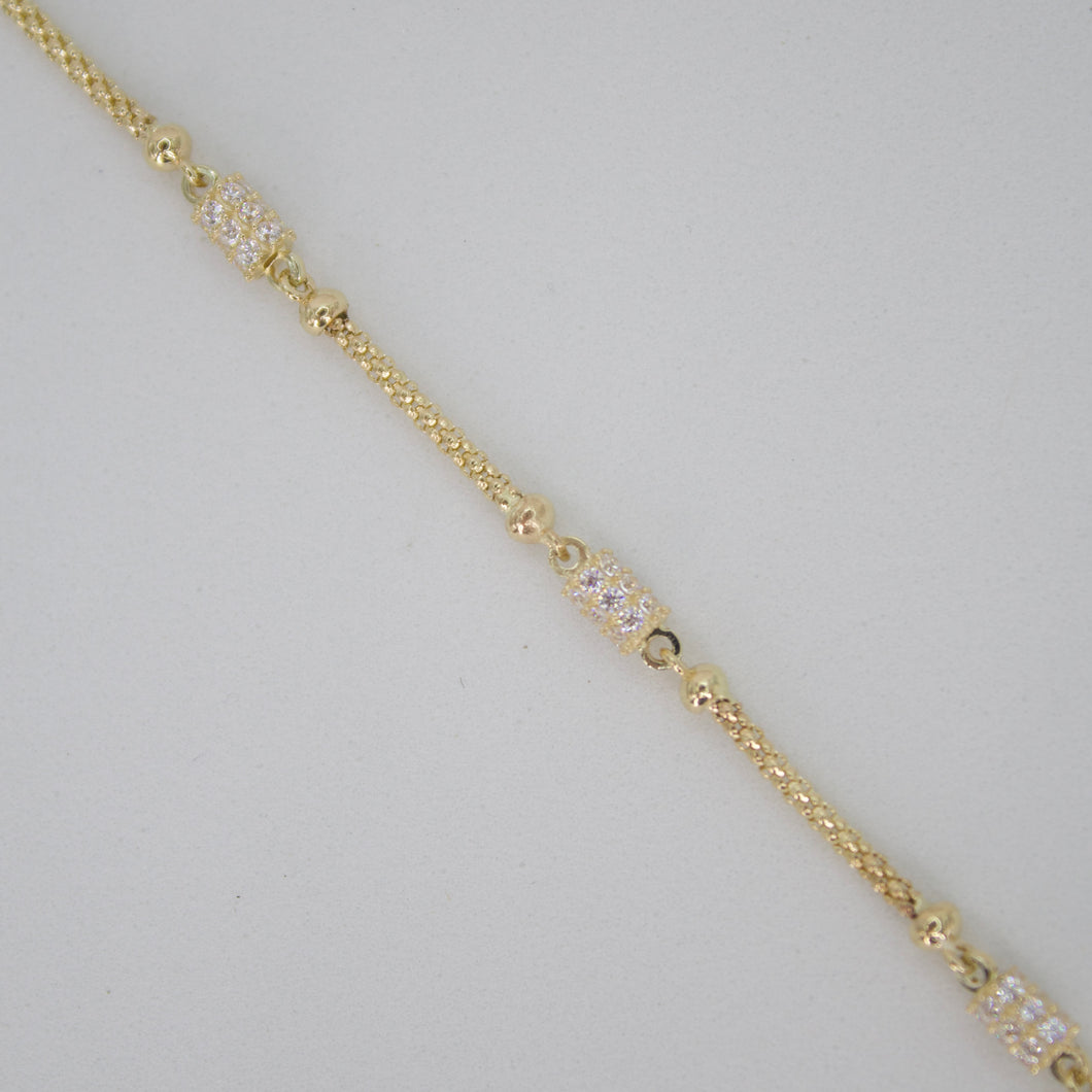 Pulsera en oro amarillo 14k con zirconias.