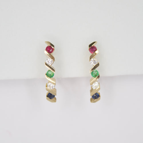 Aretes en oro amarillo 14k con rubí,diamantes,esmeralda y zafiros.