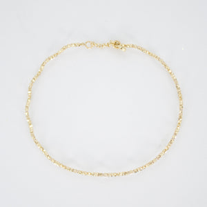 Pulsera rígida de bolitas en oro amarillo 14k.