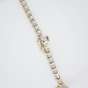 Brazalete en oro combinado 14k con diamantes.