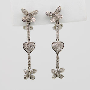 Aretes en oro blanco 14k con diamantes.