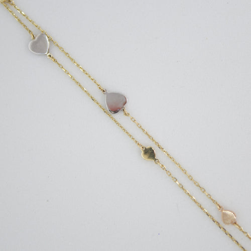 Pulsera de corazones en oro amarillo 14k.