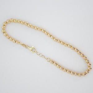 Pulsera de bolitas en oro amarillo 14k.