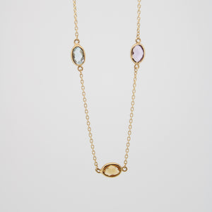 Gargantilla en oro amarillo 14k con gemas naturales.