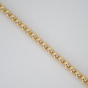Pulsera de bolitas en oro amarillo 14k.