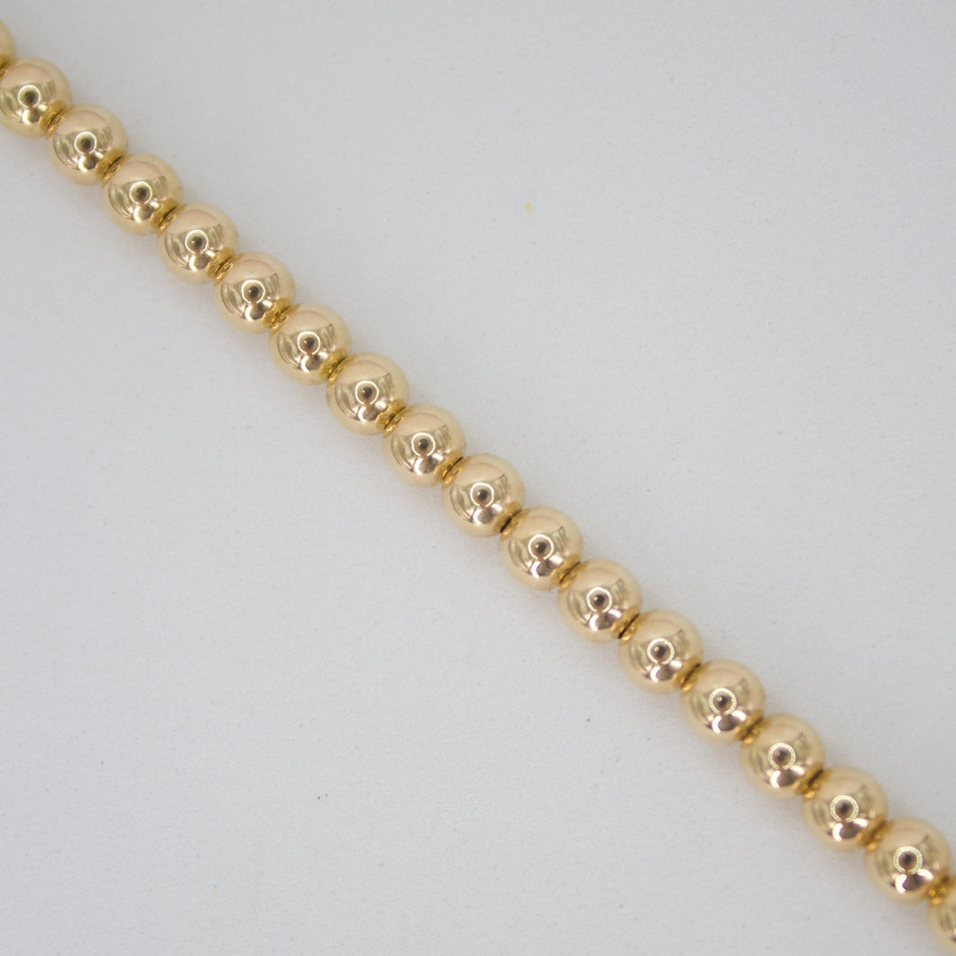 Pulsera de bolitas en oro amarillo 14k.