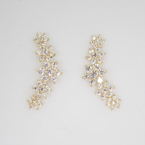 Aretes flores en oro amarillo 14k con zirconias.
