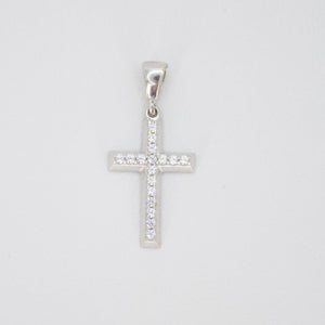 Cruz en oro blanco 14k con zirconias.
