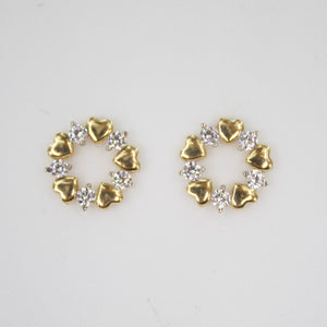 Aretes corazones en oro amarillo 14k con zirconias.