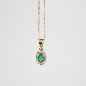 Juego en oro amarillo 14k con esmeralda y diamantes.