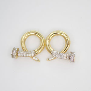 Arete tornillo en oro amarillo 14k con zirconias.
