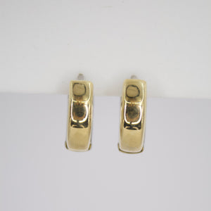 Aretes Huggies en oro combinado 14k.