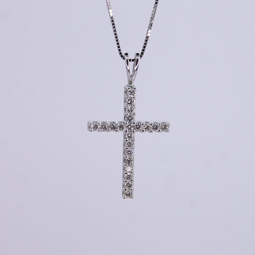 Cruz en oro blanco 14k con diamantes.