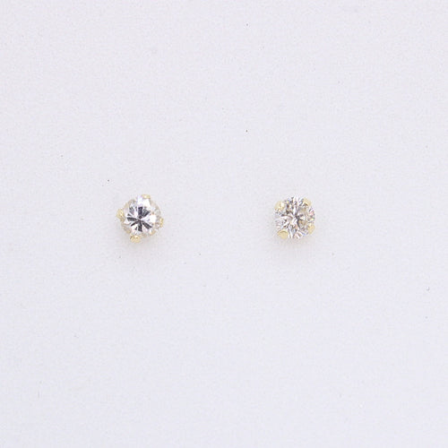 Broquel en oro amarillo 14k con diamante.