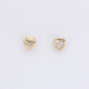 Broquel corazón en oro amarillo 14k con zirconias.